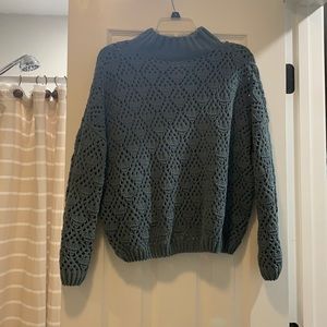 Knitted green sweater